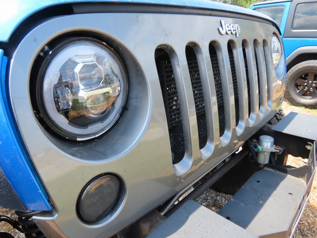 Used 2014 Jeep Wrangler Unlimited Sport with VIN 1C4BJWDG3EL241363 for sale in Ozark, MO