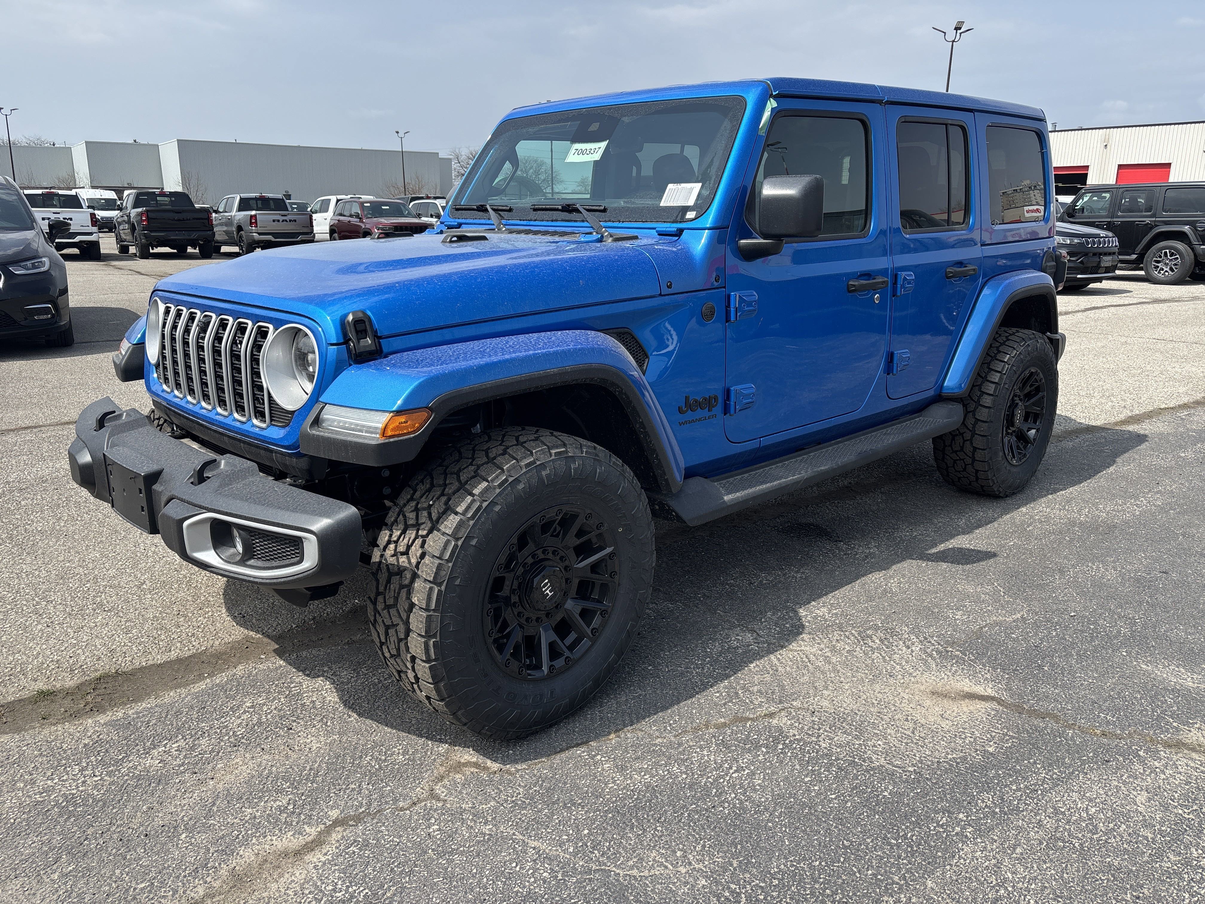 New 2025 Hydro Blue Pearl Jeep Sahara image 1