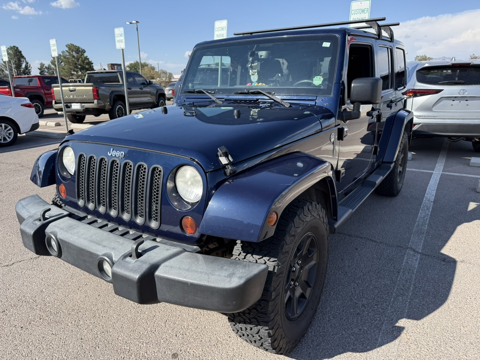 Used 2013 BLUE Jeep Sahara image 1