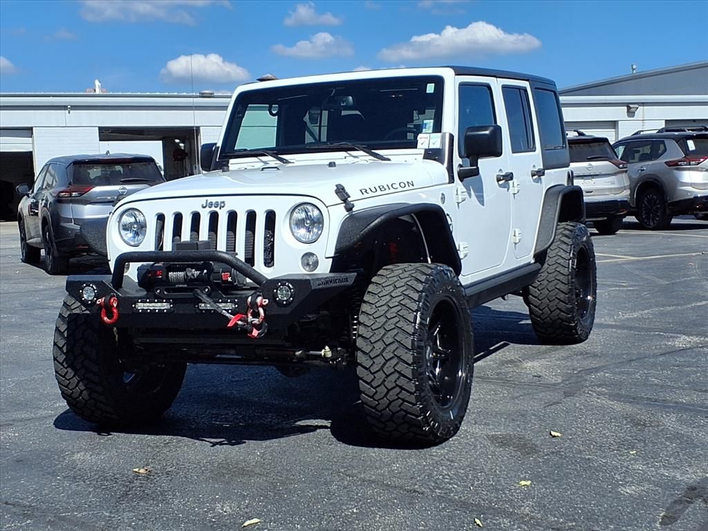 Used 2016 Jeep Wrangler Unlimited Rubicon with VIN 1C4BJWFG4GL161098 for sale in Kansas City