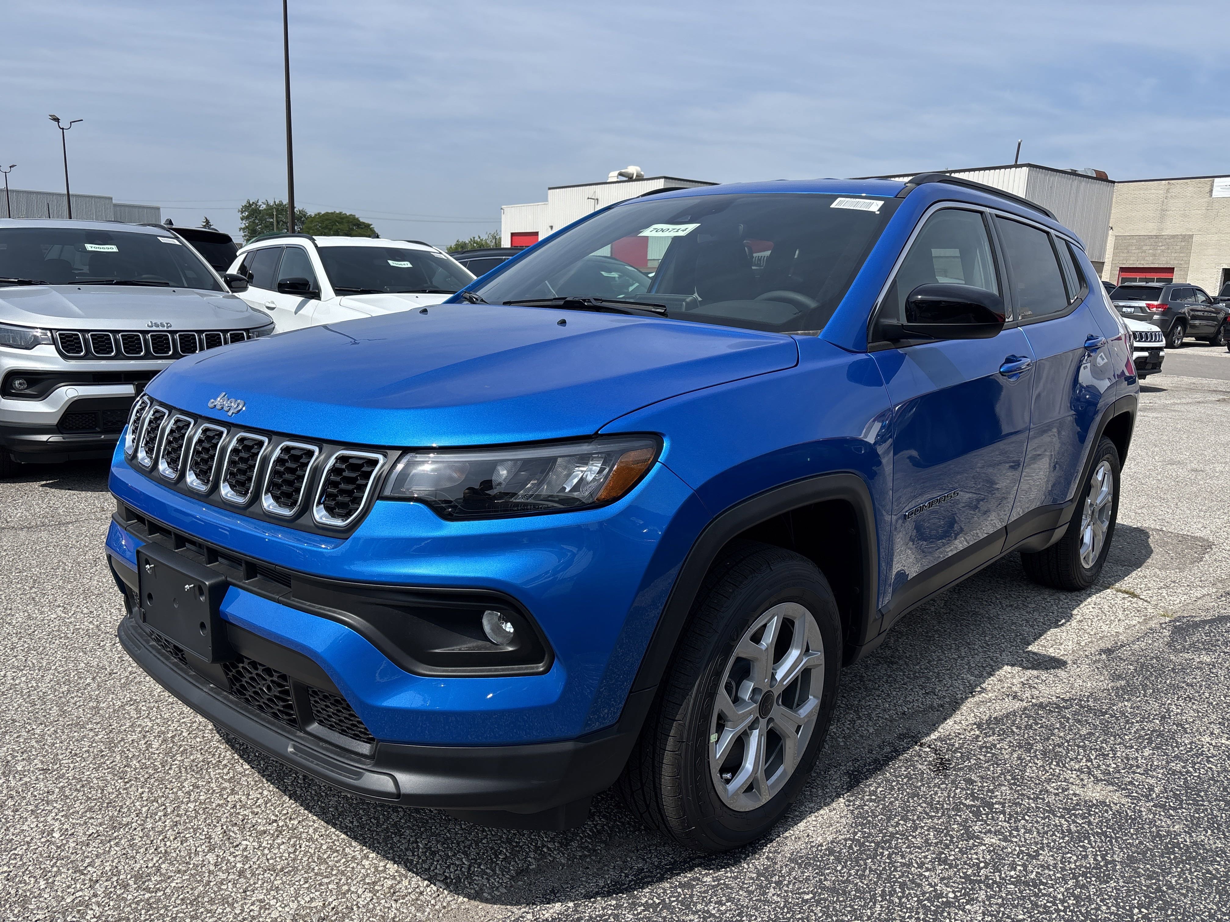New 2025 Laser Blue Pearl Jeep North image 1
