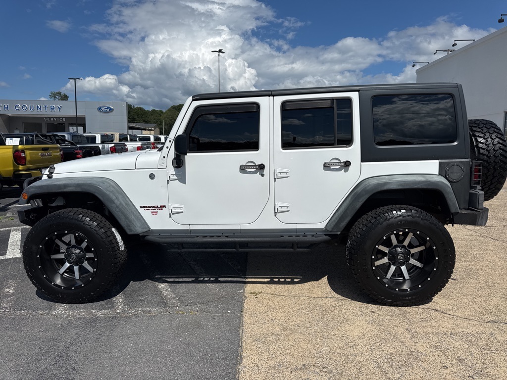 Used 2014 Jeep Wrangler Unlimited Sport with VIN 1C4BJWDG0EL308193 for sale in Arab, AL