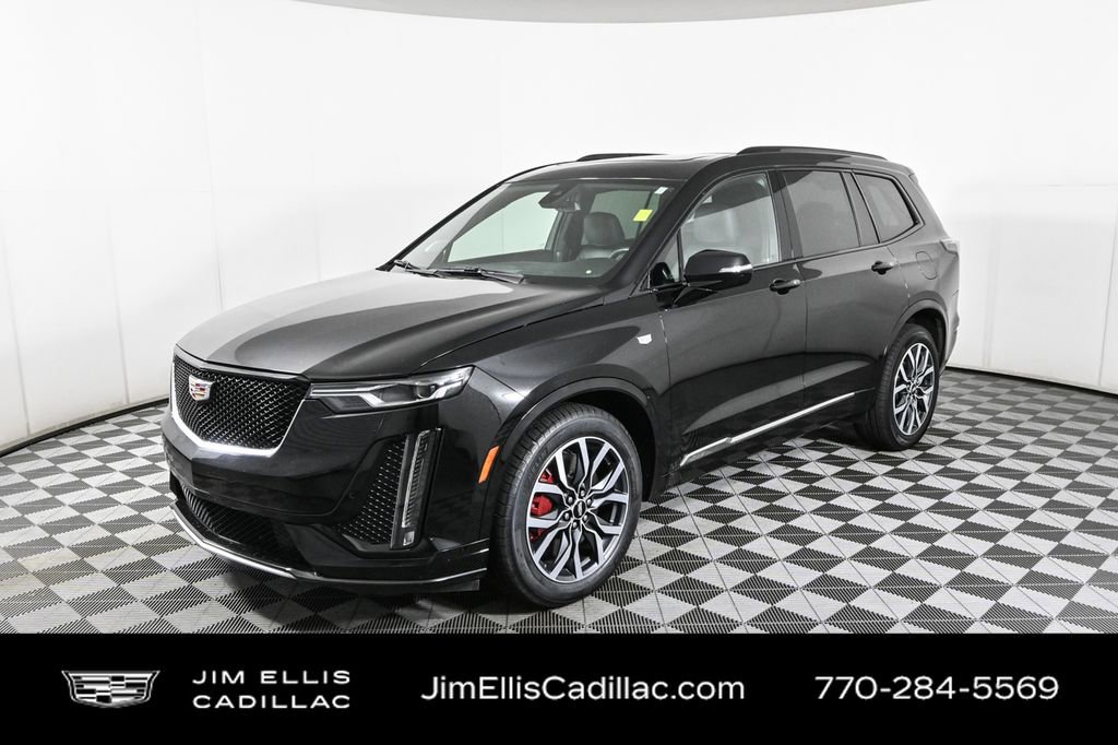 Certified Used 2024 Stellar Black Metallic Cadillac Sport image 1