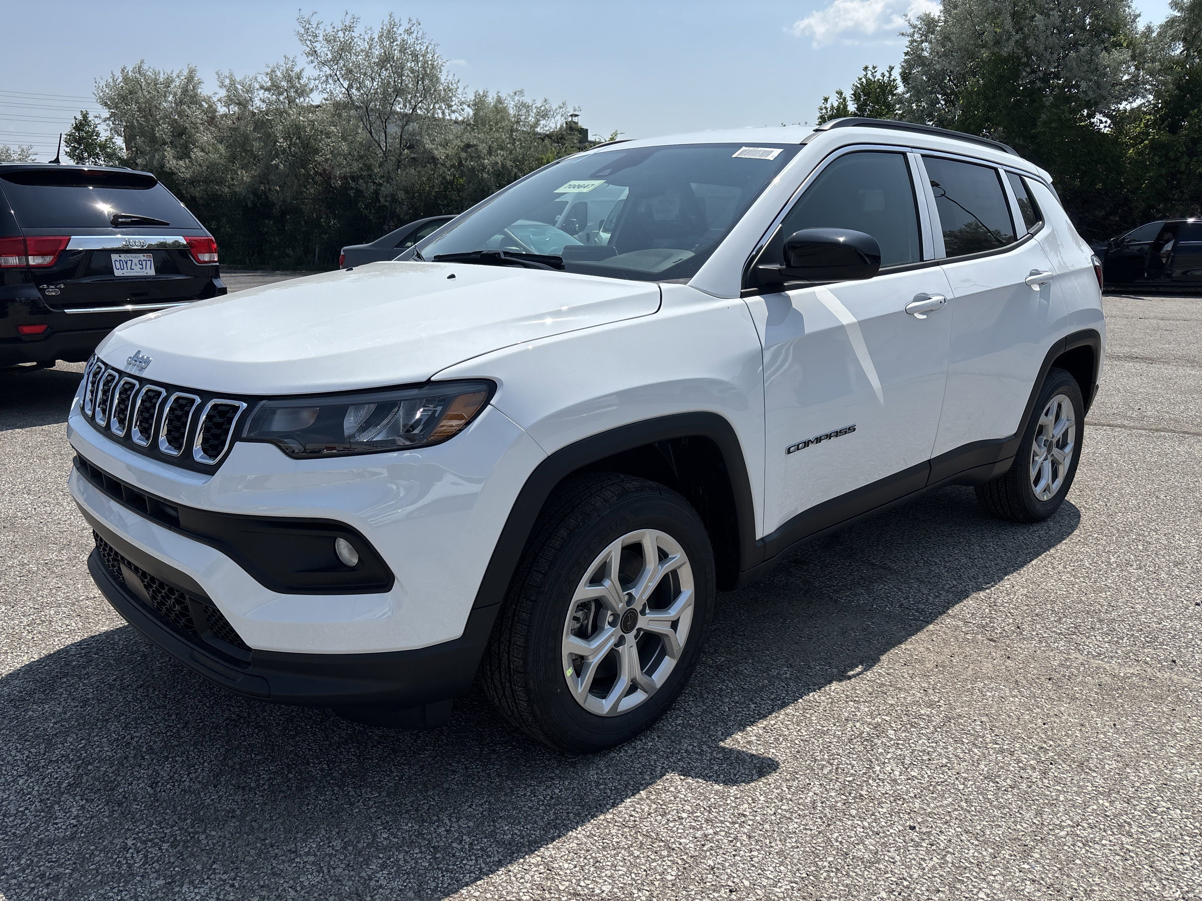 New 2025 Bright White Jeep North image 1