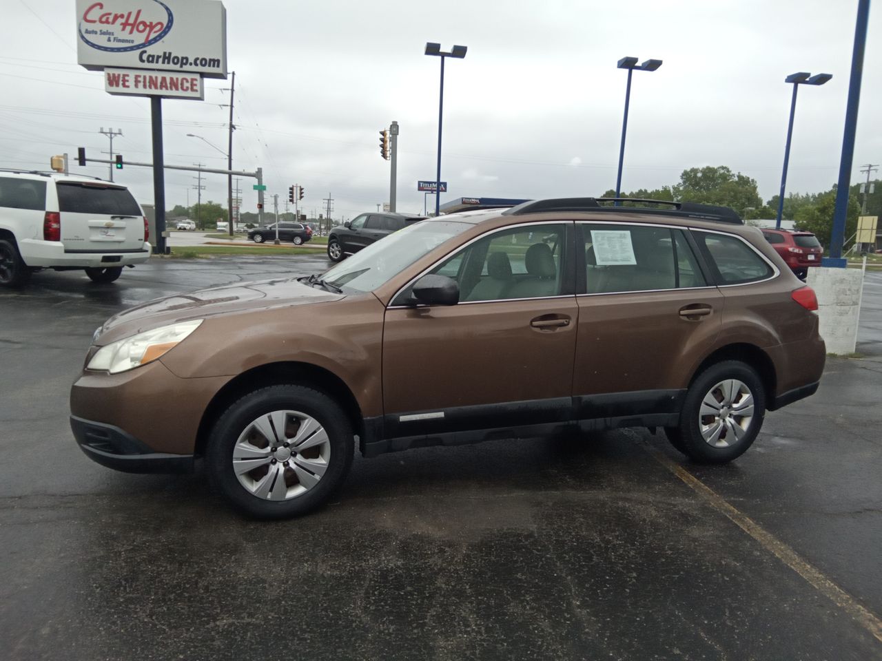 Used 2011 Gold Subaru 2.5I image 1