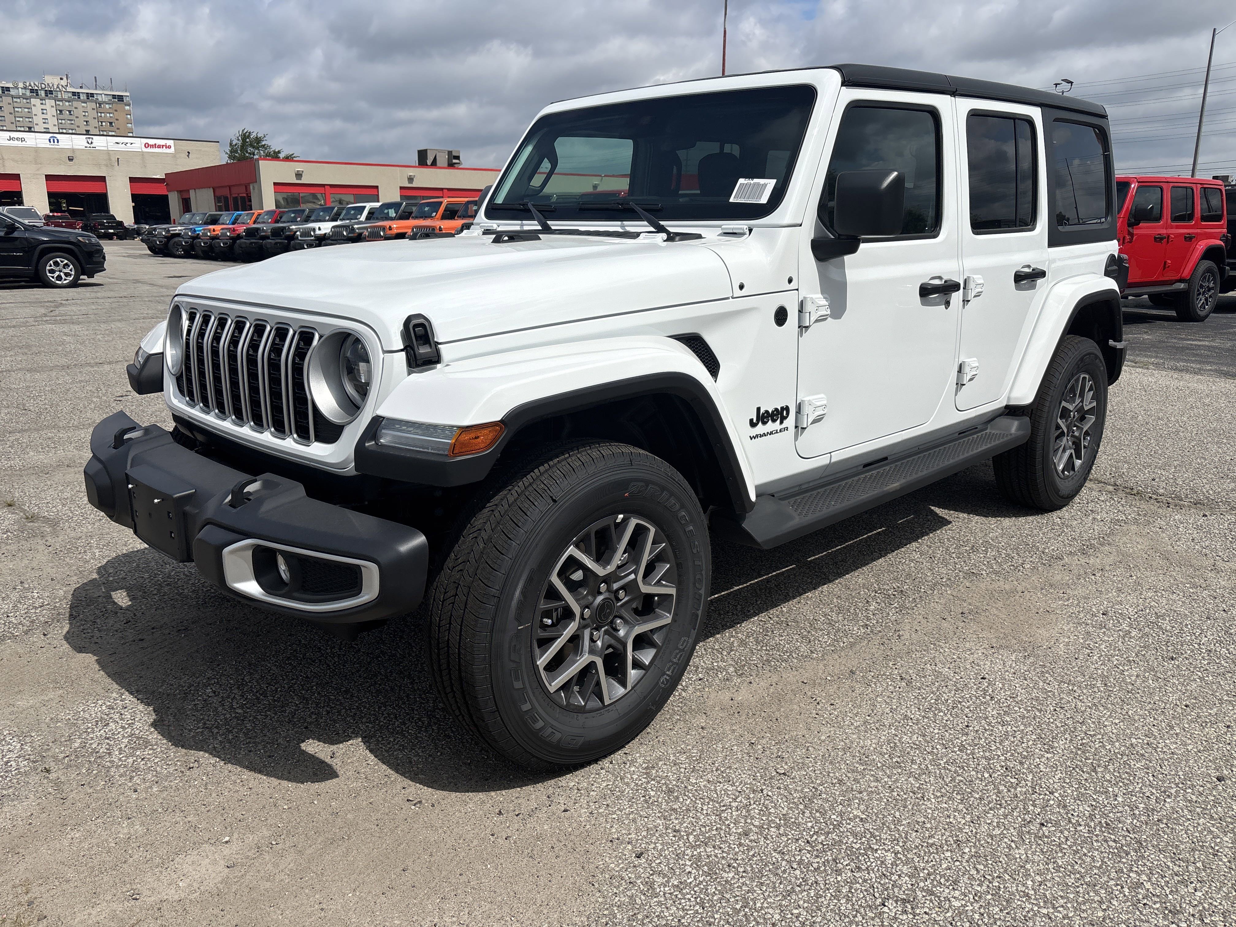 New 2025 Bright White Jeep Sahara image 1