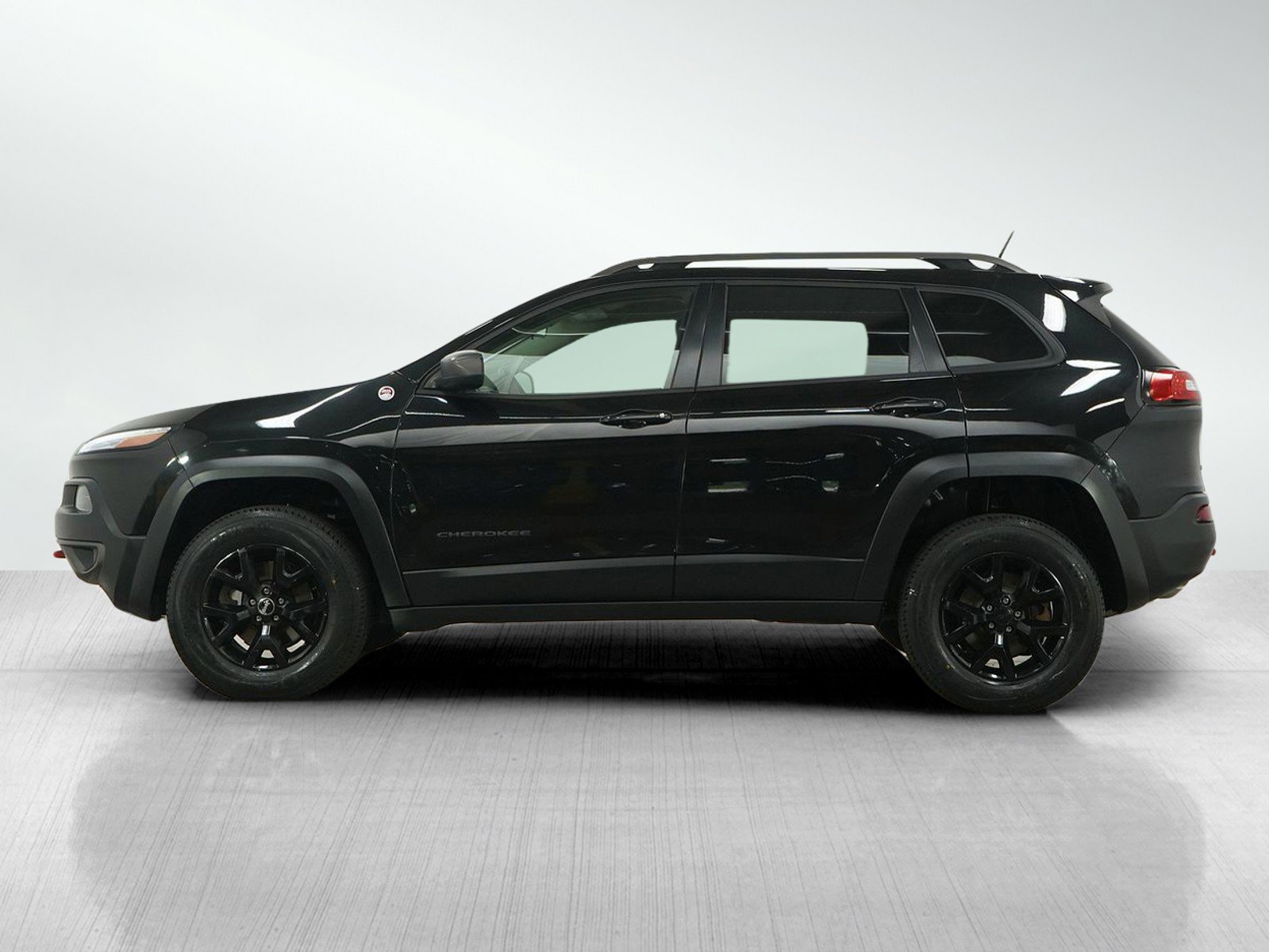 Used 2015 Jeep Cherokee Trailhawk with VIN 1C4PJMBS7FW767237 for sale in Hopkins, Minnesota