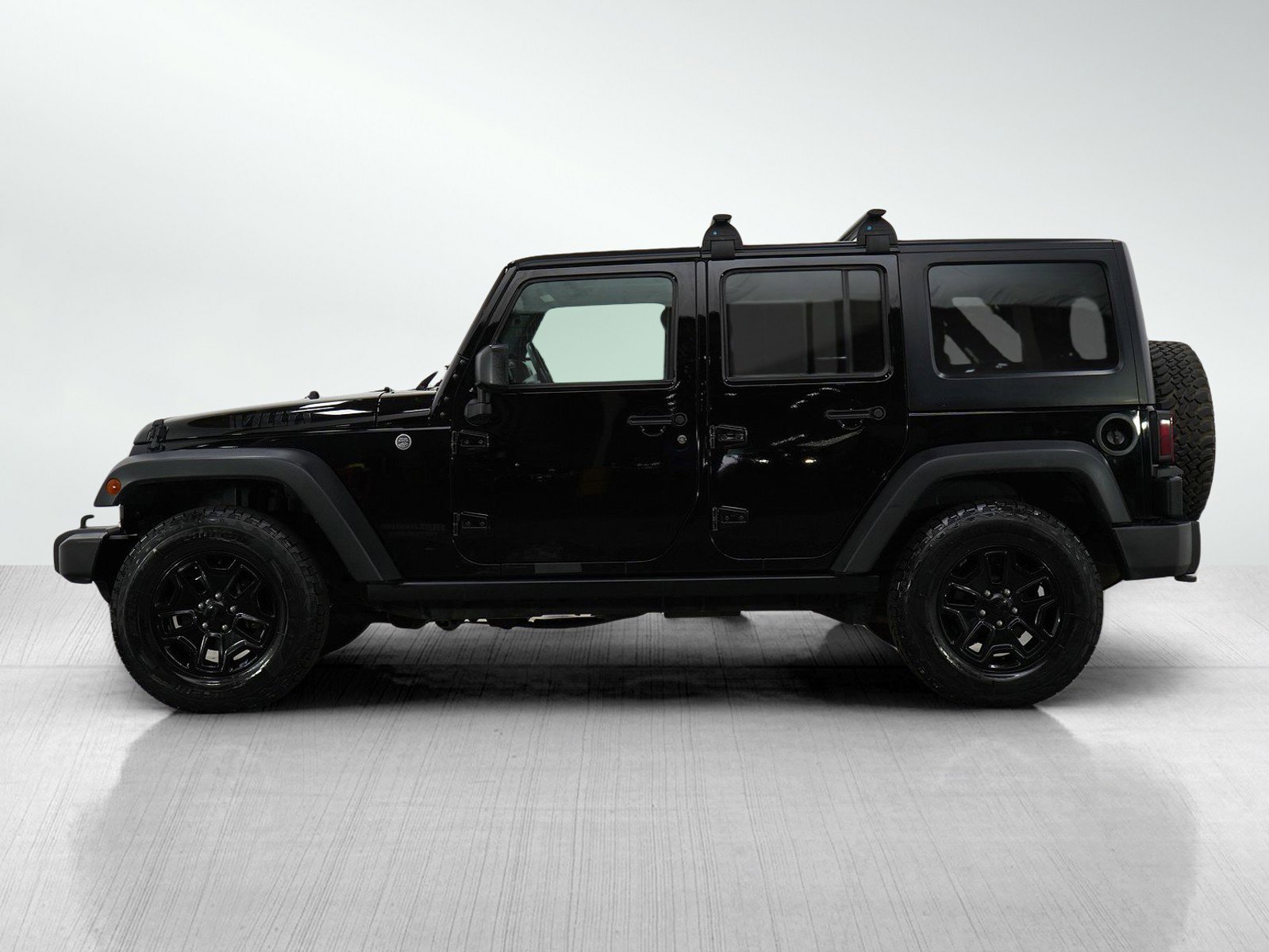 Used 2018 Jeep Wrangler Unlimited Willys Wheeler with VIN 1C4BJWDGXJL825253 for sale in Minneapolis, Minnesota
