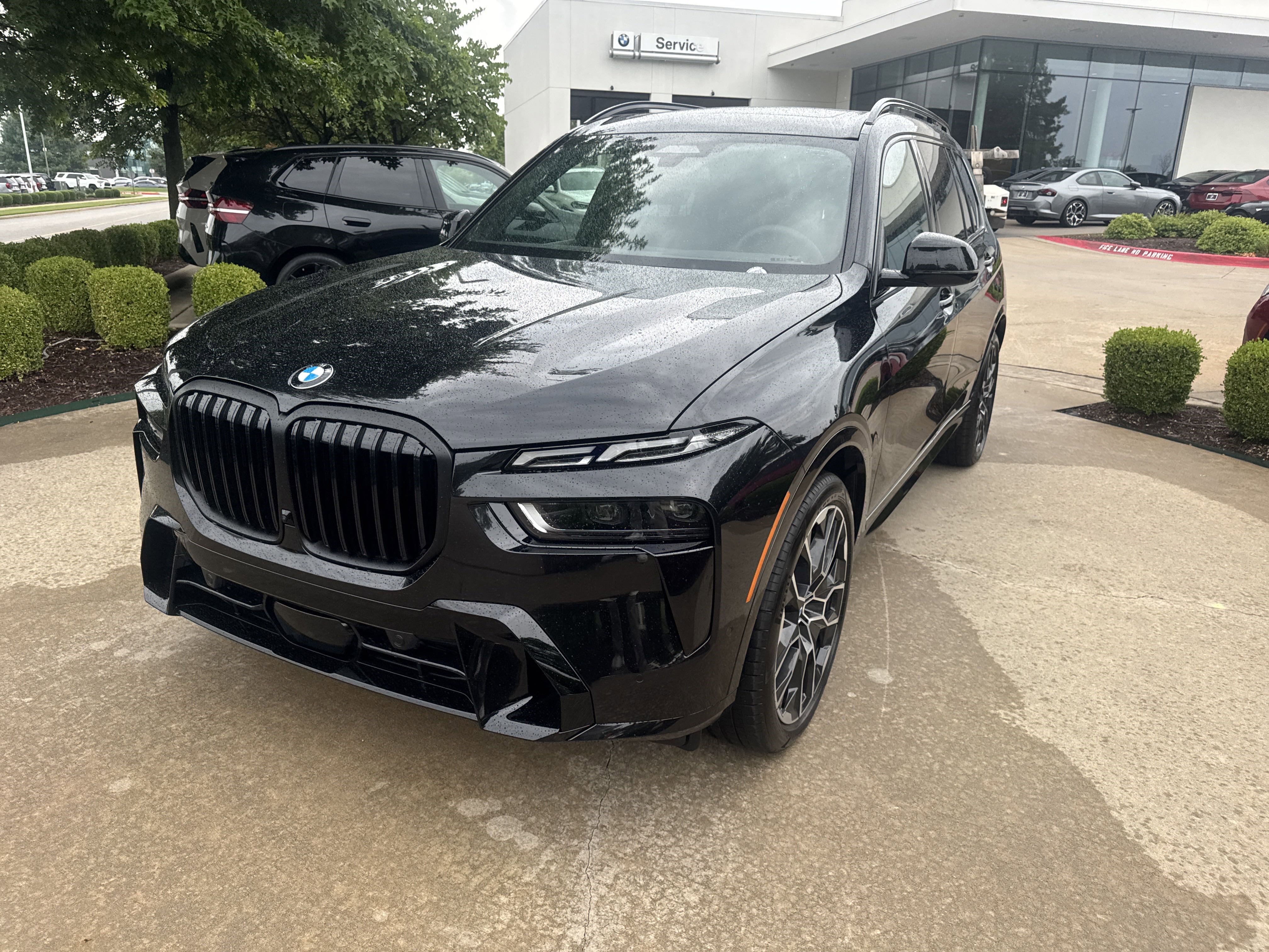 New 2026 0475 Black Sapphire Metallic BMW xDrive40i image 1