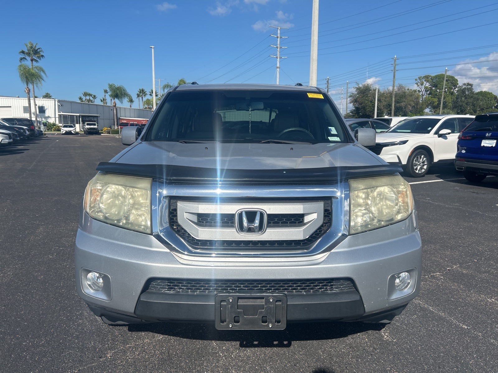 Used 2011 Honda Pilot EX-L with VIN 5FNYF4H54BB070453 for sale in Port Richey, FL