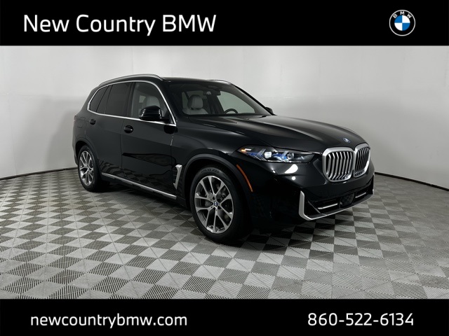 New 2026 Black Sapphire Metallic BMW xDrive50e image 1
