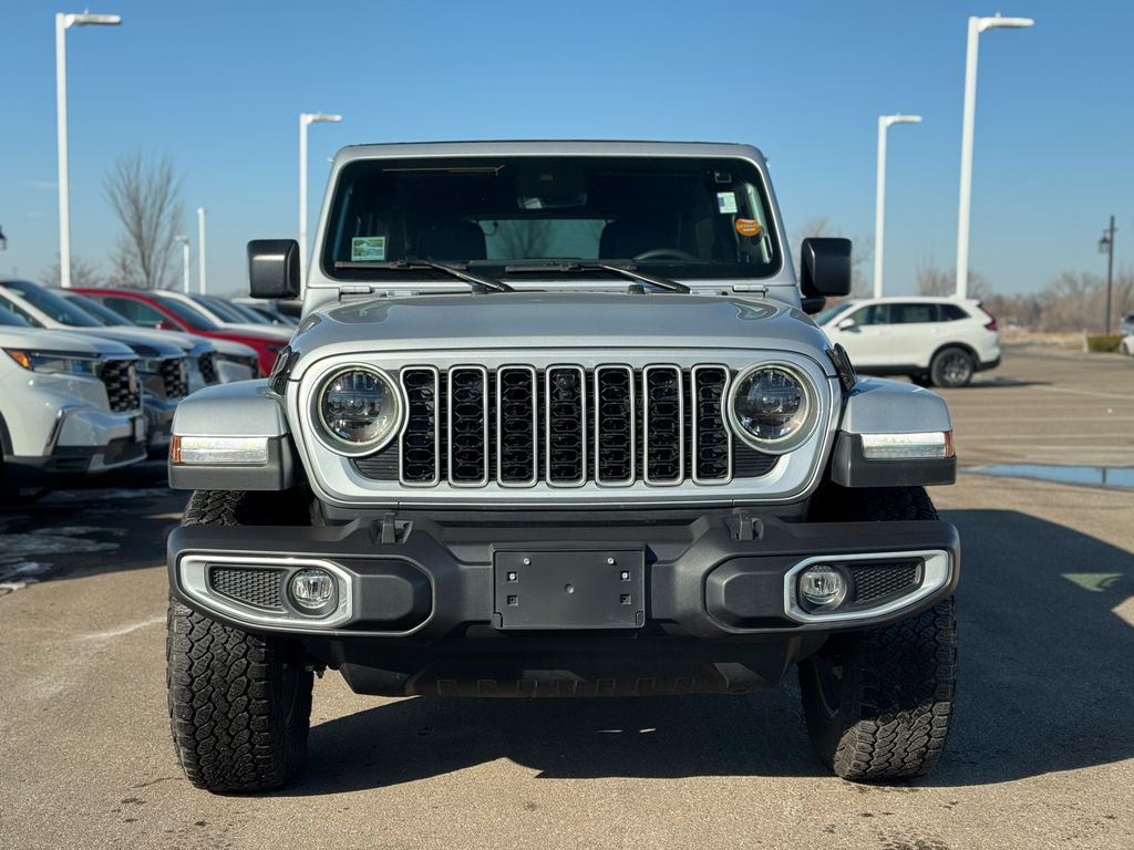 Used 2024 Jeep Wrangler 4-Door Sahara with VIN 1C4PJXEN2RW137170 for sale in Coon Rapids, Minnesota