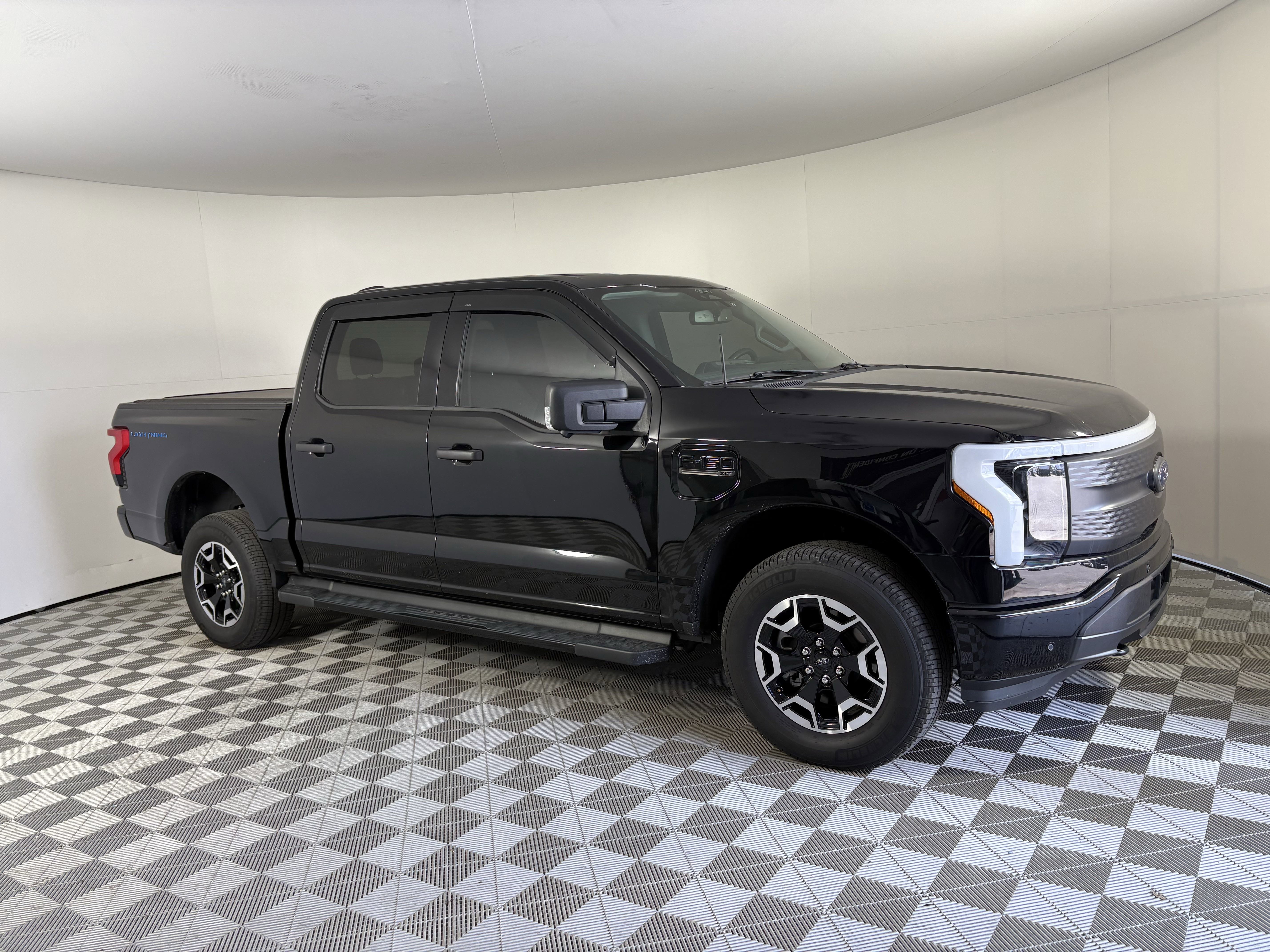 Used 2022 Ford F-150 Lightning XLT with VIN 1FTVW1ELXNWG09761 for sale in Port Richey, FL