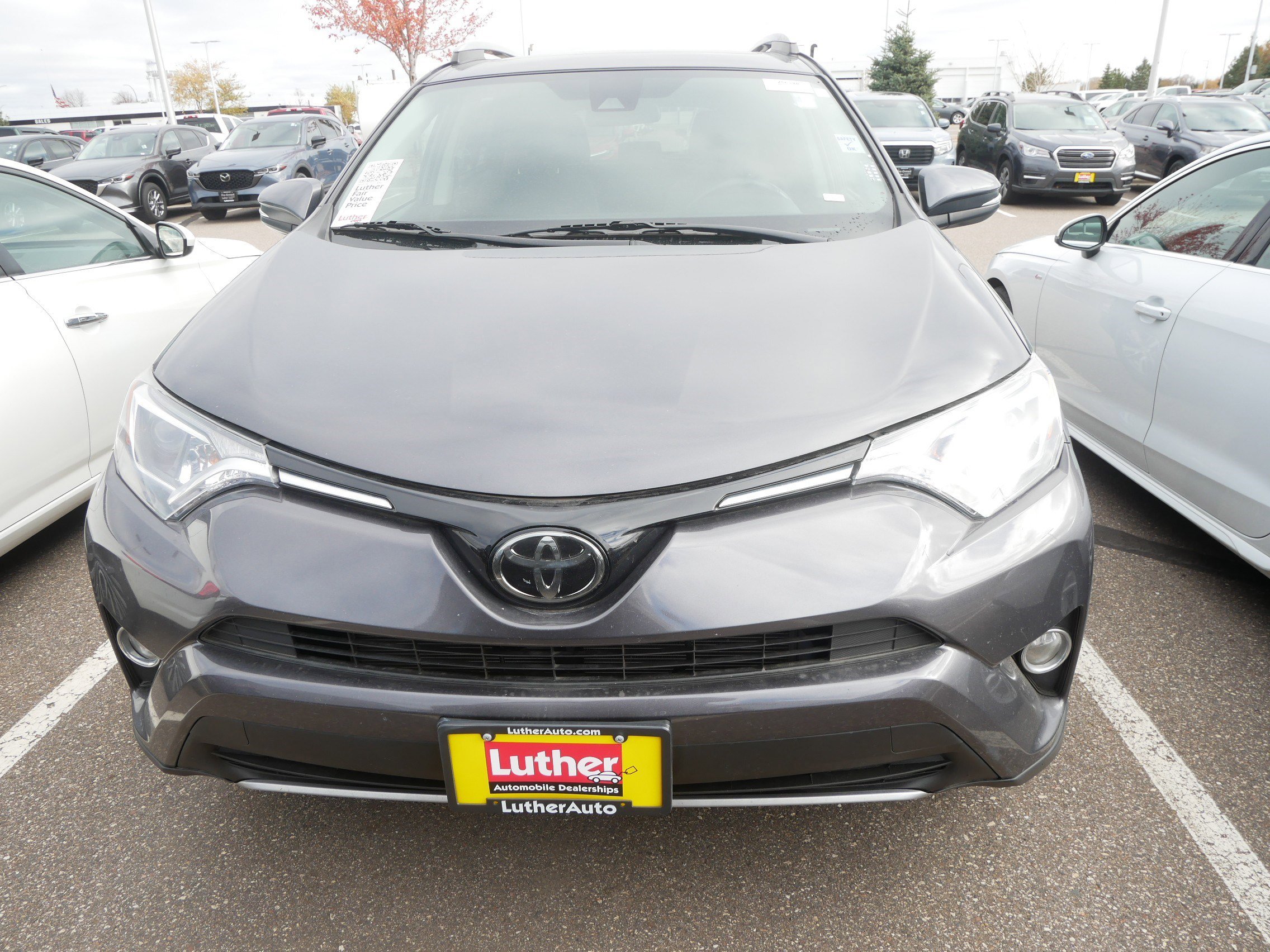 Used 2018 Toyota RAV4 XLE with VIN 2T3WFREV3JW475723 for sale in Brooklyn Center, Minnesota