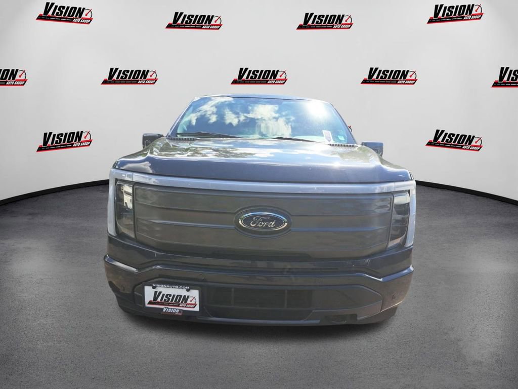 Used 2022 Ford F-150 Lightning Lariat with VIN 1FTVW1EV0NWG08040 for sale in Rochester, NY
