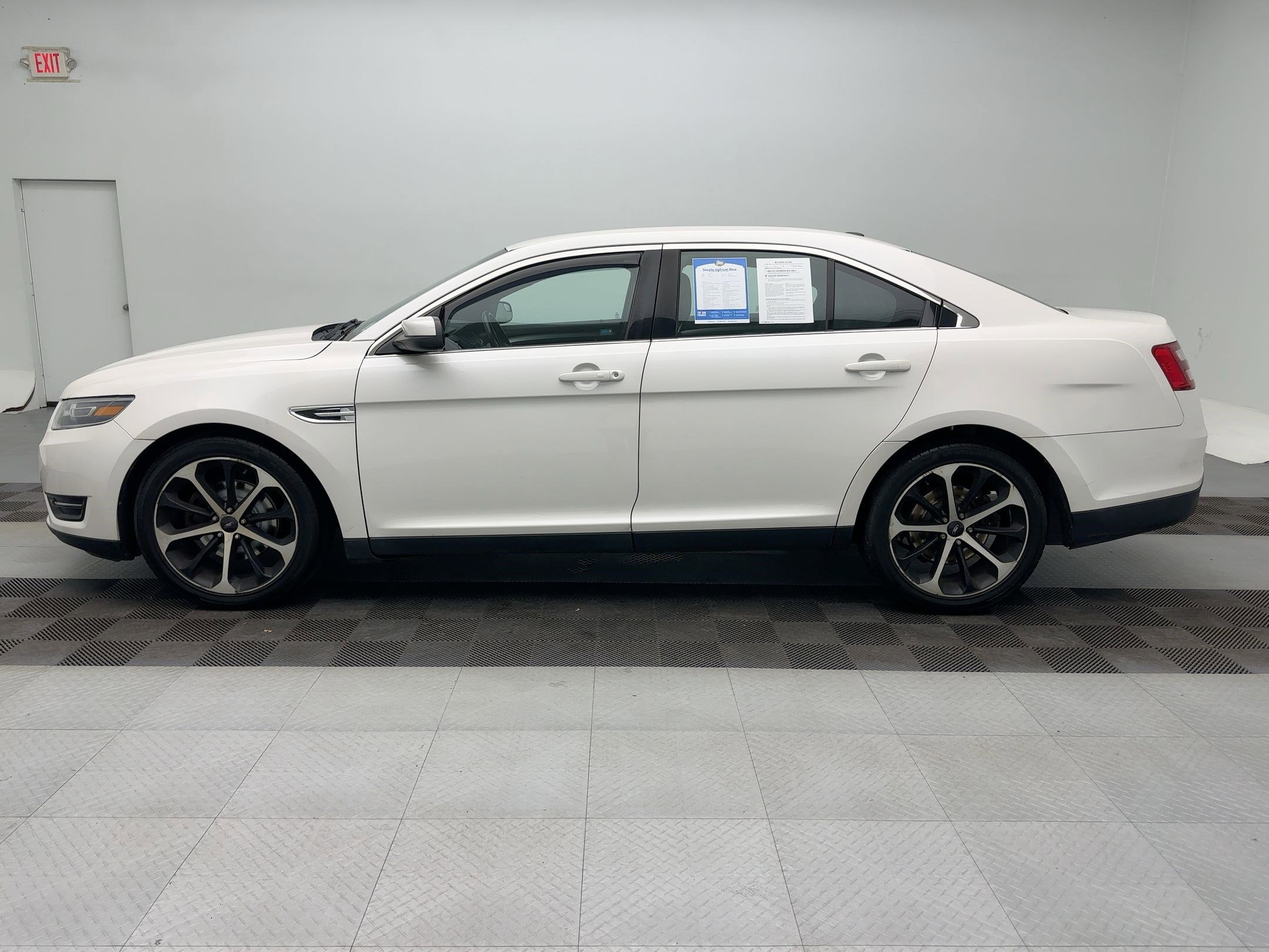 Used 2015 Ford Taurus SEL with VIN 1FAHP2H8XFG166181 for sale in Chittenango, NY