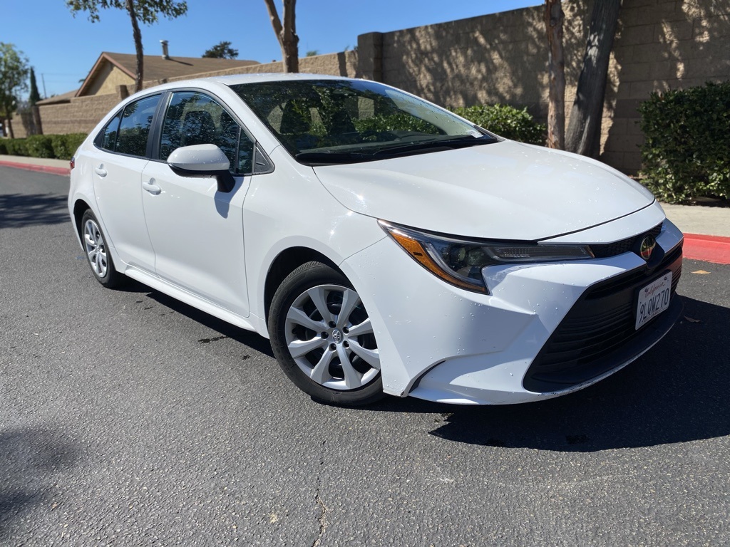 Used 2024 White Toyota LE image 1