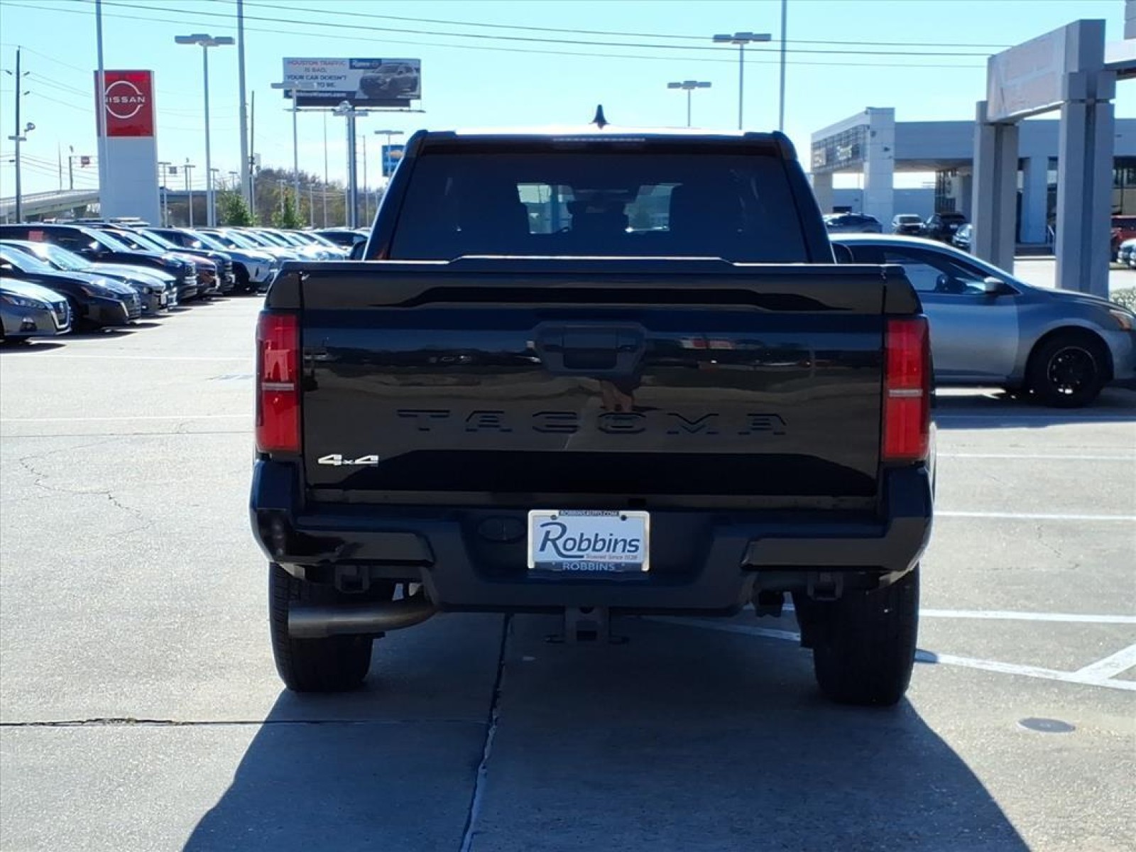 2024 Toyota Tacoma 4WD TRD Off Road Black at Robbins Nissan