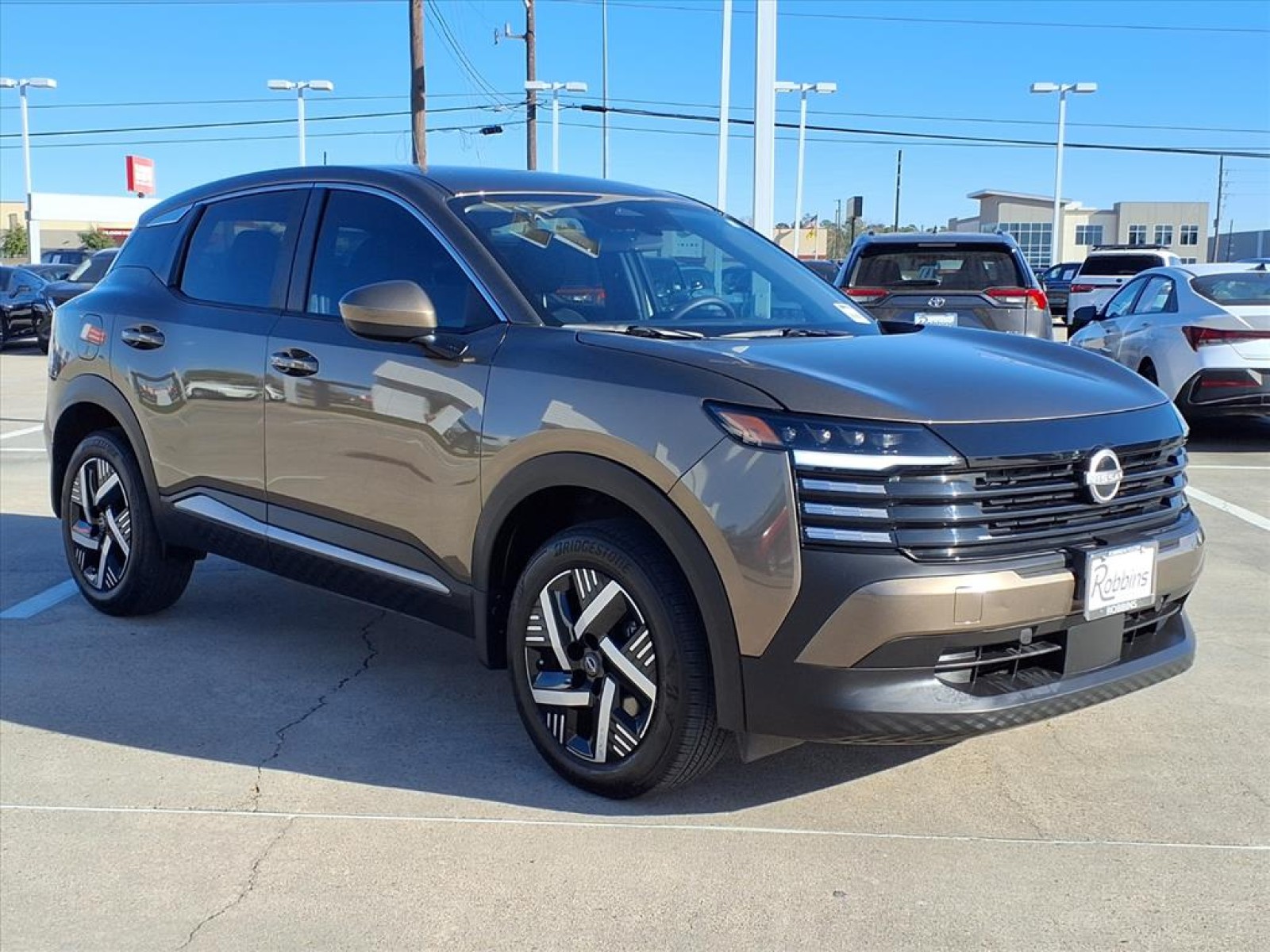 2025 Nissan Kicks SV Brown at Robbins Nissan