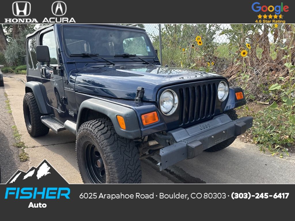 Used 2000 Patriot Blue Pearlcoat/Black Soft Top Jeep SE image 1