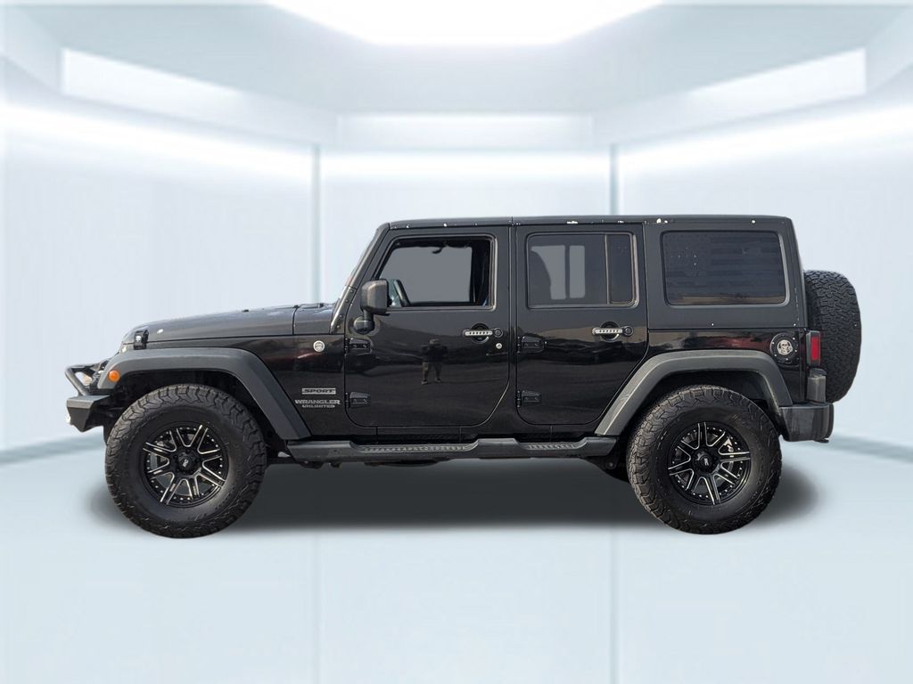 Used 2014 Jeep Wrangler Unlimited Sport with VIN 1C4BJWDG6EL156999 for sale in Foley, AL