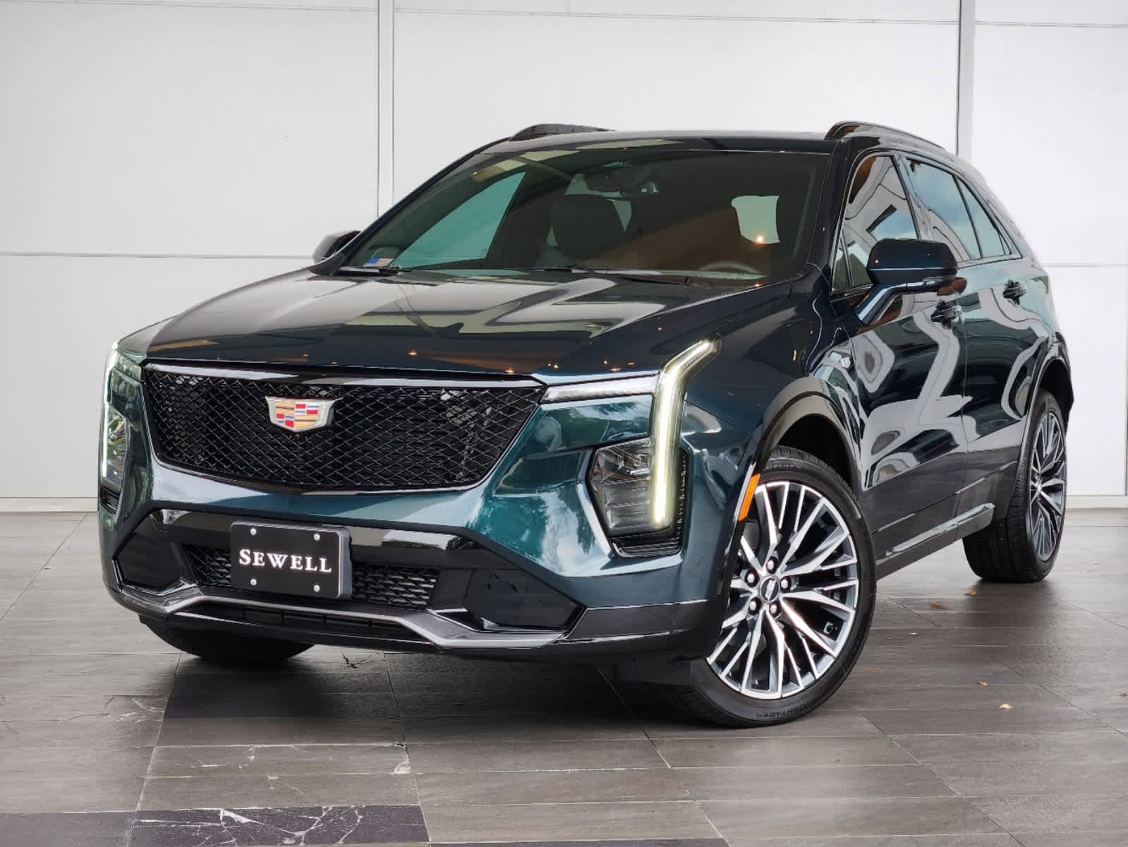 New 2025 Emerald Lake Metallic Cadillac Sport image 1