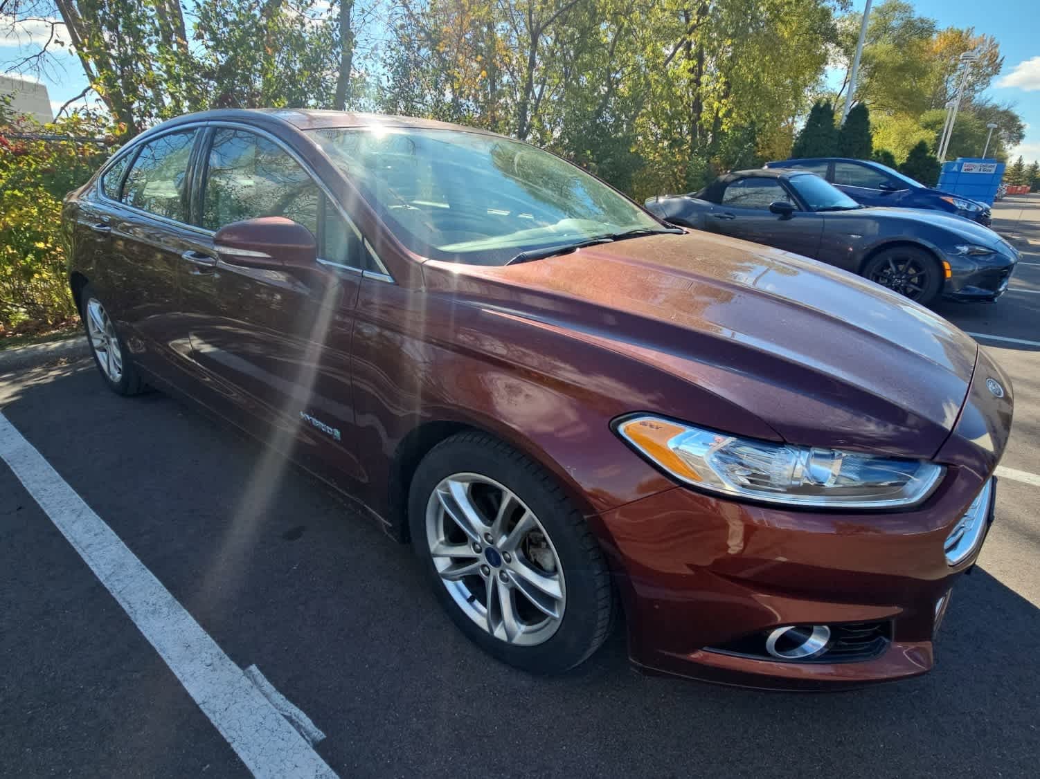 Used 2015 Ford Fusion Hybrid Titanium with VIN 3FA6P0RUXFR305368 for sale in Hopkins, Minnesota