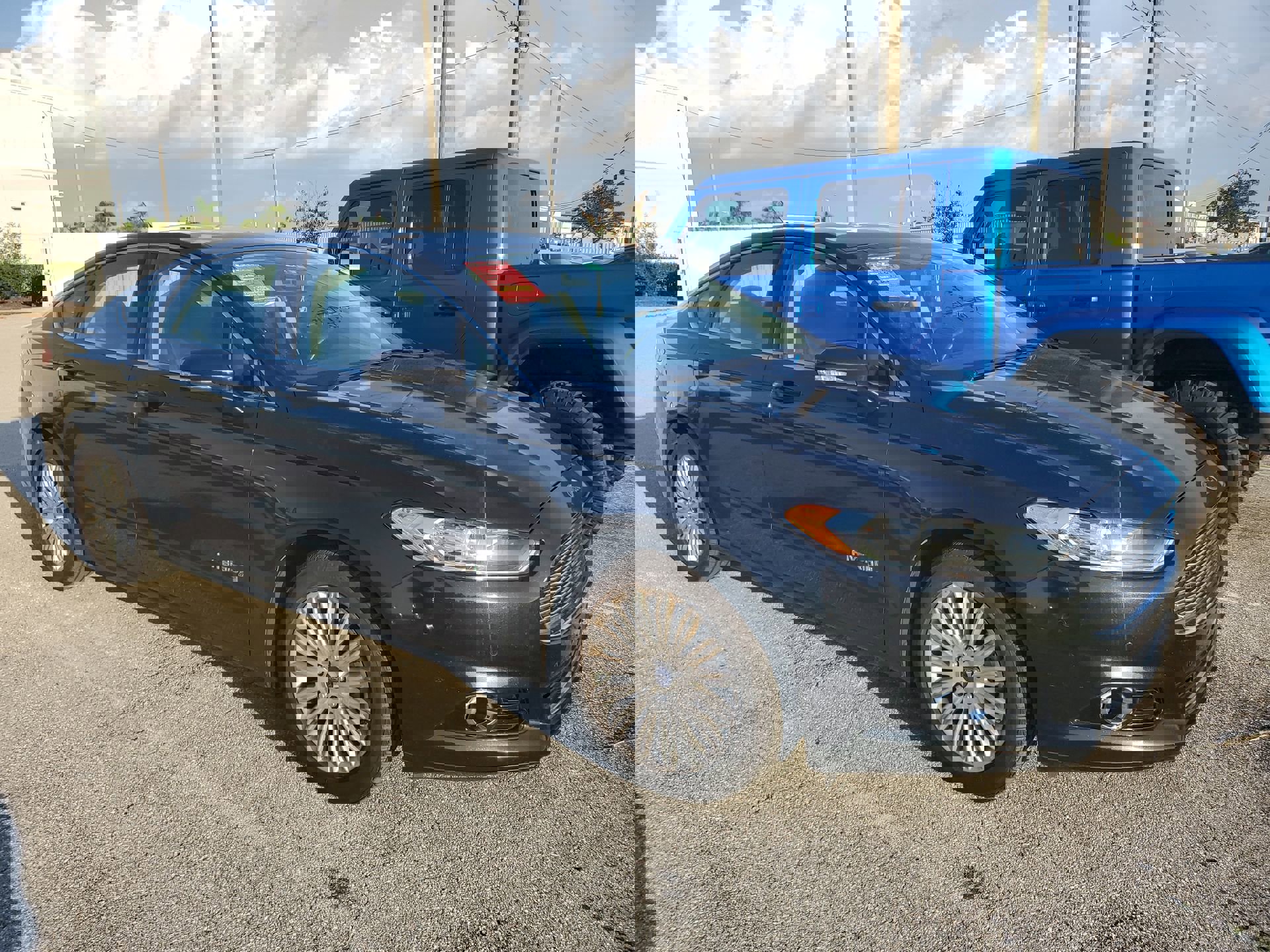 Used 2014 Ford Fusion SE Hybrid with VIN 3FA6P0LU6ER204030 for sale in Punta Gorda, FL