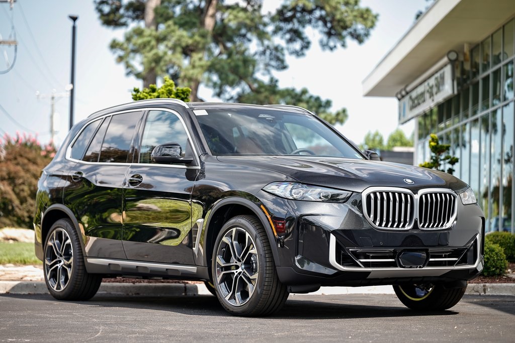 New 2026 Black Sapphire Metallic BMW xDrive50e image 1