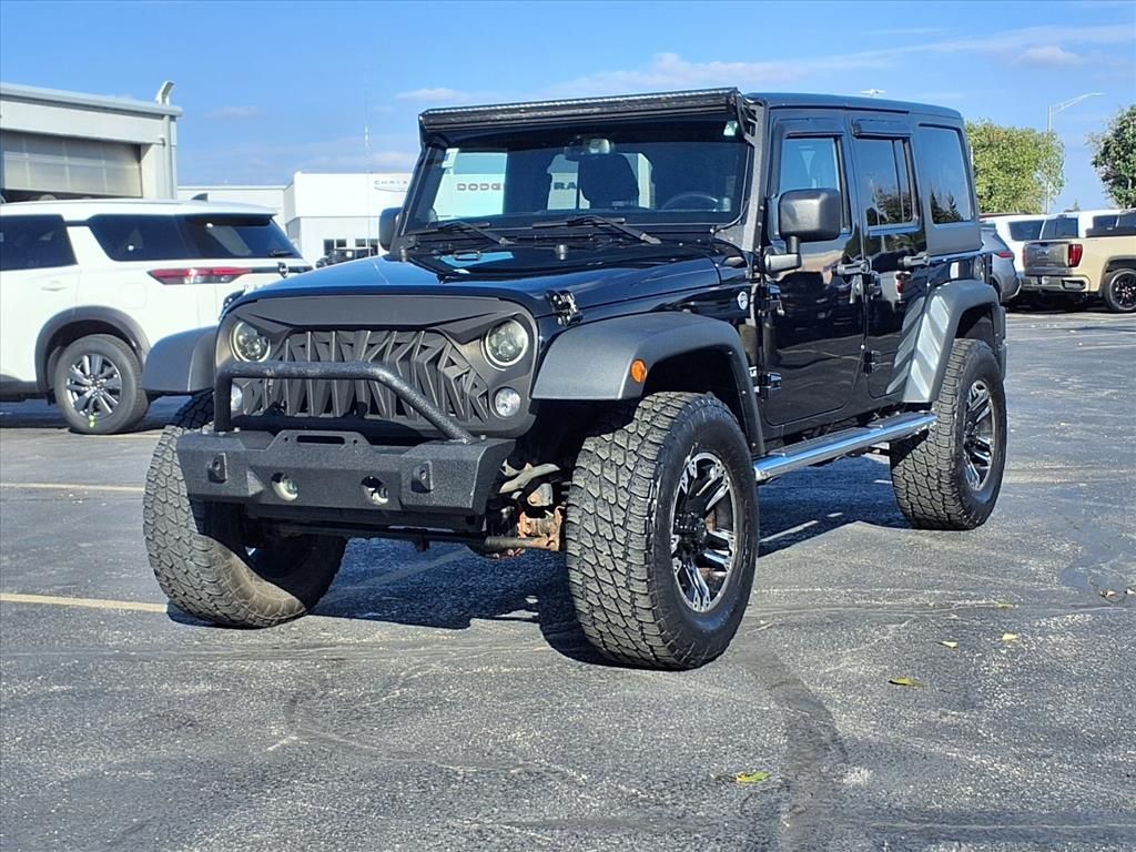 Used 2014 Jeep Wrangler Unlimited Sport with VIN 1C4BJWDG3EL102690 for sale in Kansas City