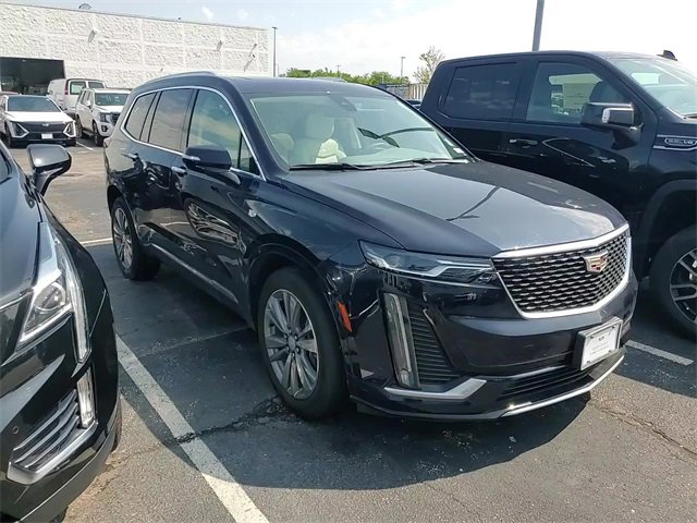 Used 2022 Dark Moon Blue Metallic Cadillac Premium Luxury image 1