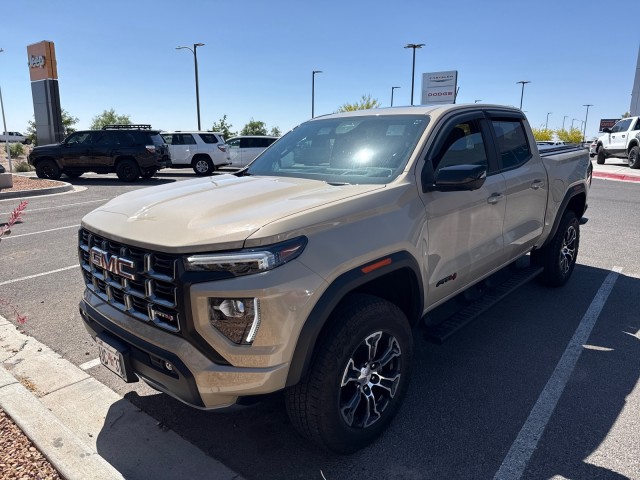 Used 2024 Desert Sand Metallic GMC 4WD AT4 image 1