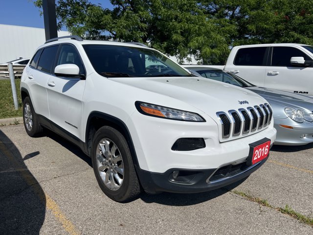 Used 2016 Bright White Jeep Limited image 1