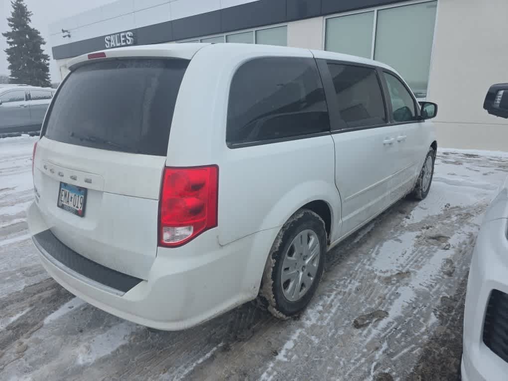 Used 2014 Dodge Grand Caravan SE with VIN 2C4RDGBG0ER130887 for sale in Brooklyn Center, Minnesota