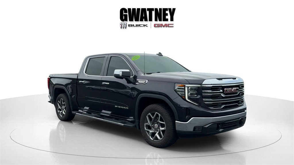 Used 2023 Titanium Rush Metallic GMC SLT image 1