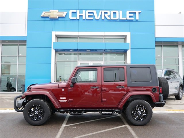 Used 2010 Jeep Wrangler Unlimited Sahara with VIN 1J4BA5H11AL127026 for sale in Roseville, Minnesota