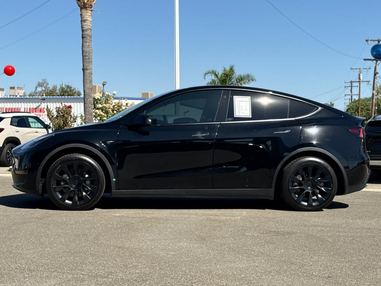 Used 2022 Tesla Model Y Long Range with VIN 7SAYGAEE6NF493123 for sale in Delano, CA