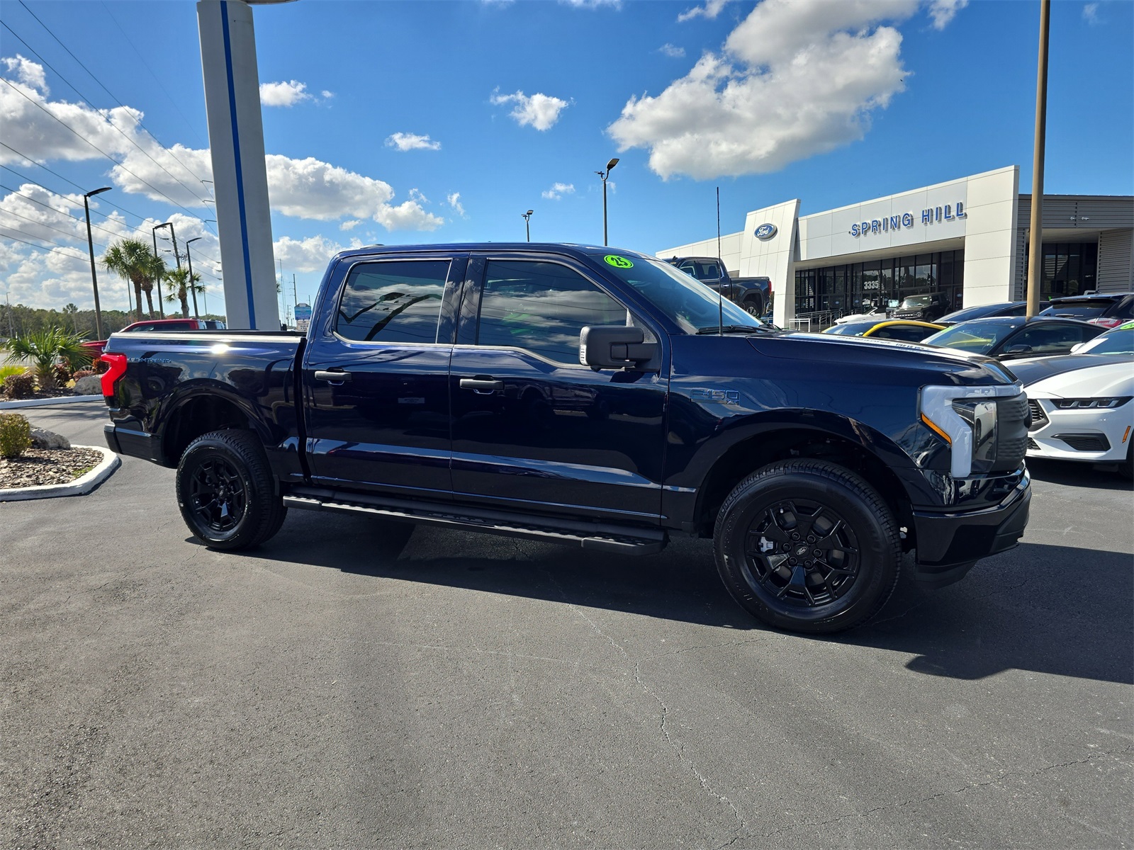 Certified 2025 Ford F-150 Lightning XLT with VIN 1FTVW3LK5SWG05022 for sale in Spring Hill, FL