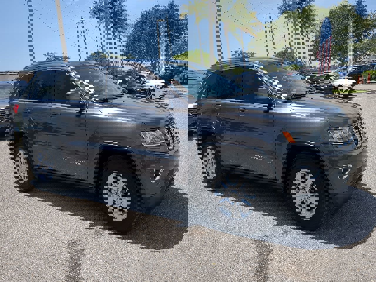 Used 2014 Jeep Grand Cherokee Laredo with VIN 1C4RJEAG0EC185606 for sale in Naples, FL