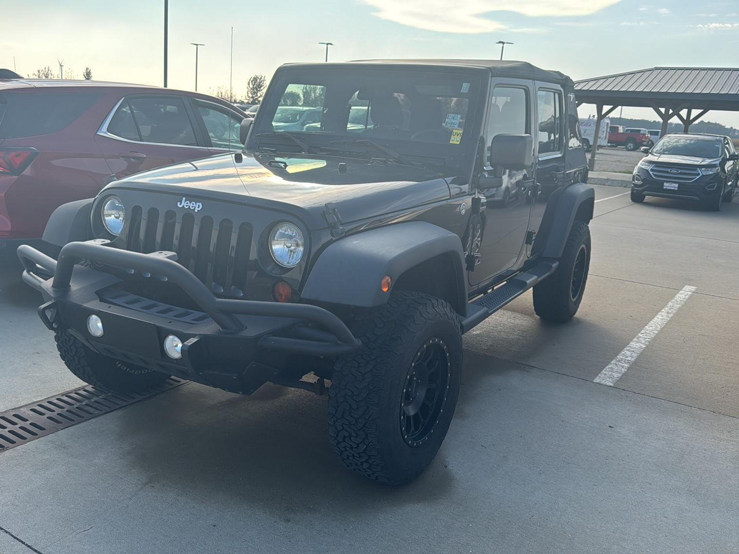 Used 2013 Jeep Wrangler Unlimited Sport with VIN 1C4BJWDG0DL705661 for sale in Charles City, IA