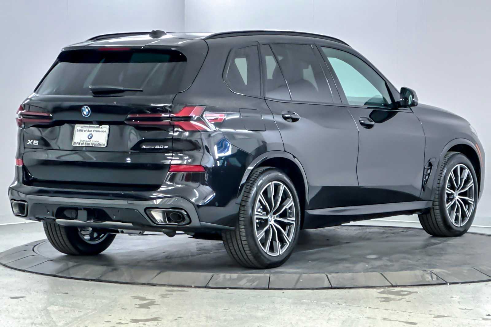 New 2026 Black Sapphire Metallic BMW xDrive50e image 2