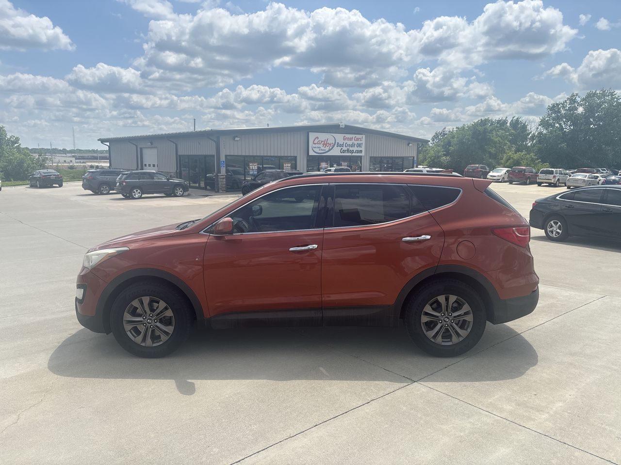 Used 2013 Orange Hyundai Sport Utility 4D image 1
