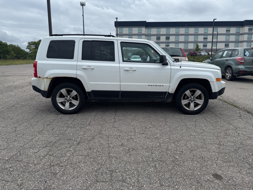 Used 2014 Jeep Patriot Latitude with VIN 1C4NJRFB2ED880859 for sale in Traverse City, MI