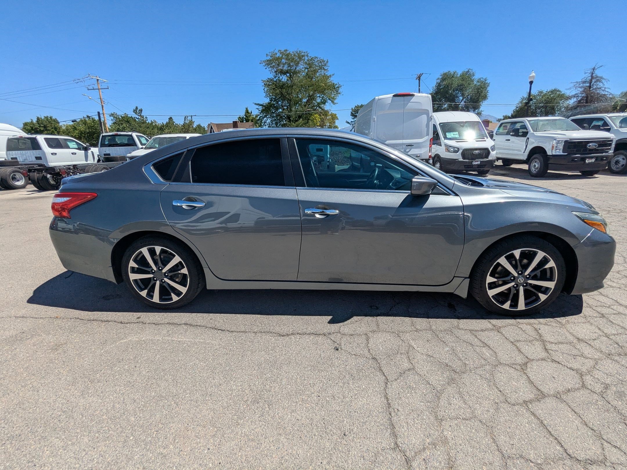 Used 2016 Nissan Altima SR with VIN 1N4AL3AP8GC285456 for sale in West Valley City, UT