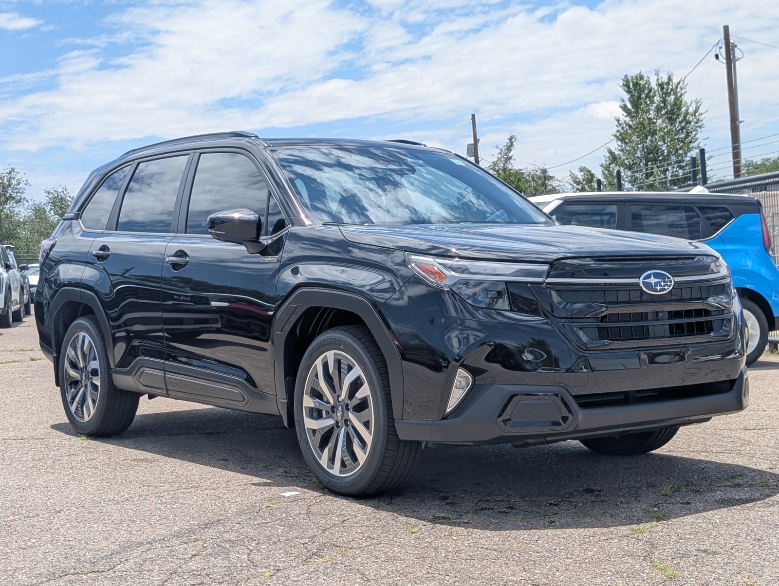 New 2025 Crystal Black Silica Subaru Touring Hybrid image 1