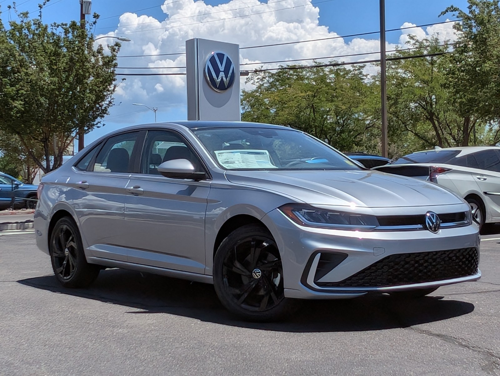 New 2025 Pyrite Silver Metallic Volkswagen SE image 1