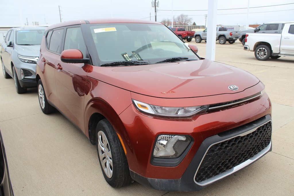 Used 2020 Orange Kia LX image 1