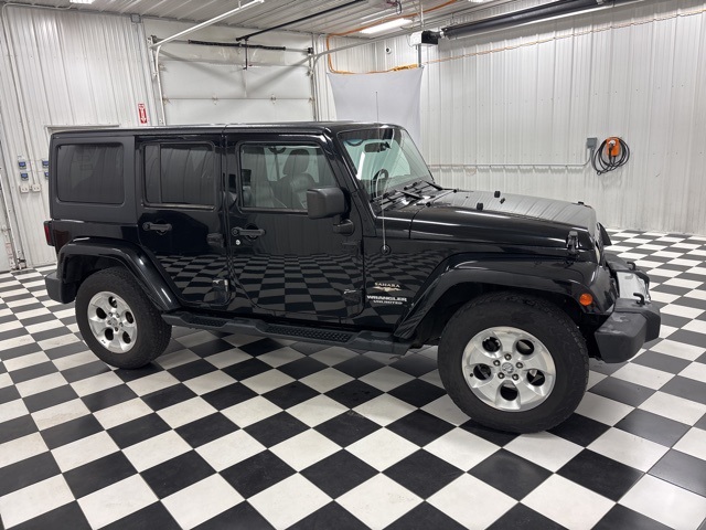 Used 2012 Jeep Wrangler Unlimited Sahara with VIN 1C4BJWEG7CL206109 for sale in Rochester, Minnesota
