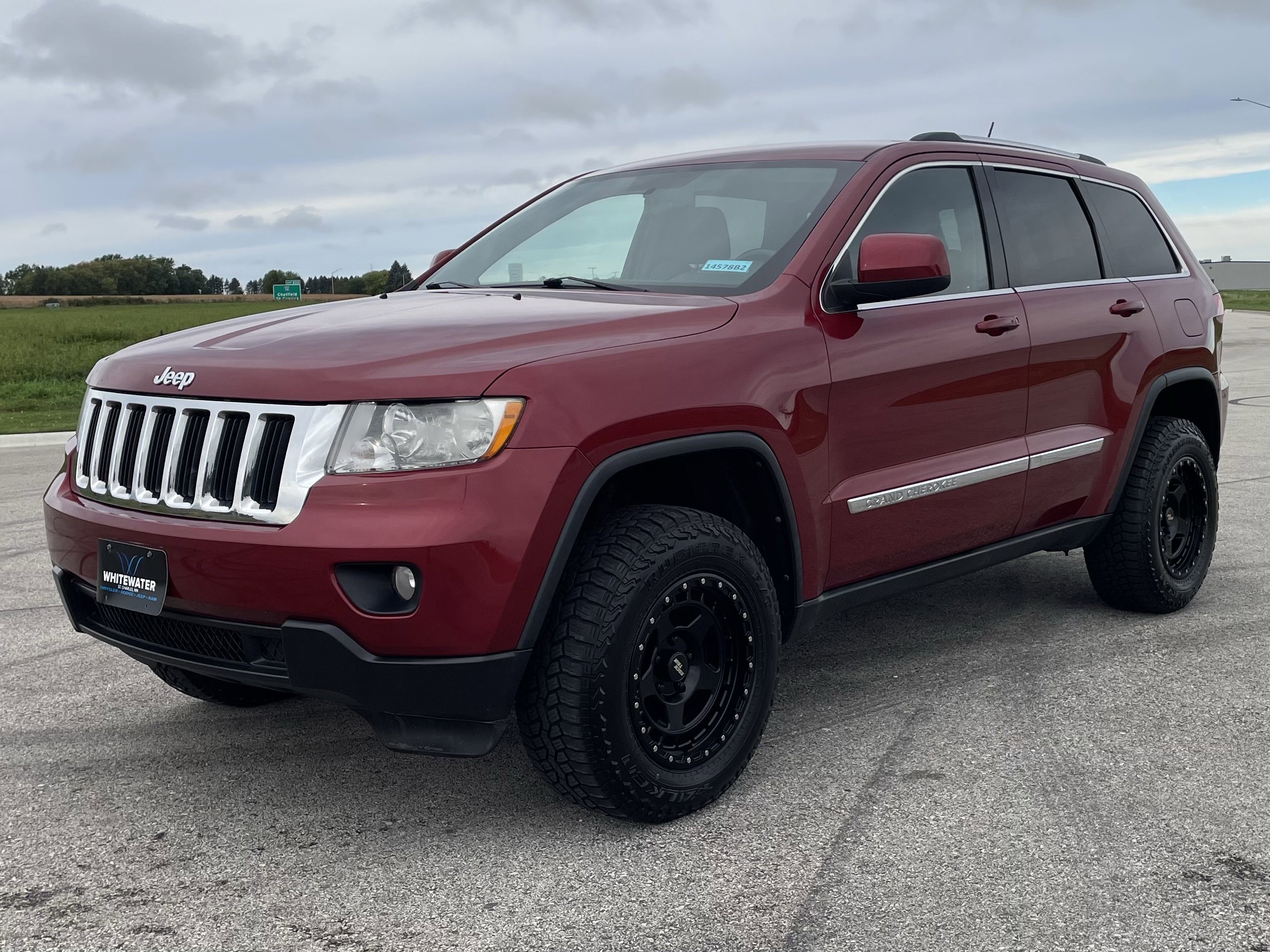 Used 2012 Jeep Grand Cherokee Laredo with VIN 1C4RJFAG3CC318457 for sale in Burnsville, Minnesota
