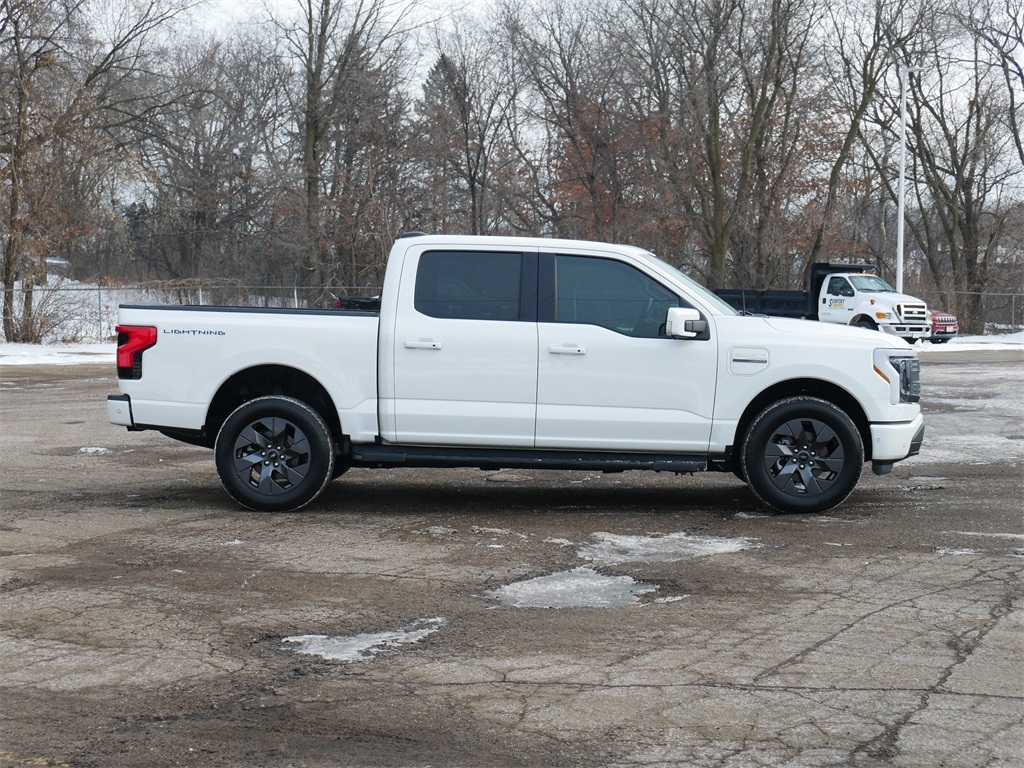 Used 2023 Ford F-150 Lightning Lariat with VIN 1FT6W1EV5PWG05285 for sale in White Bear Lake, MN